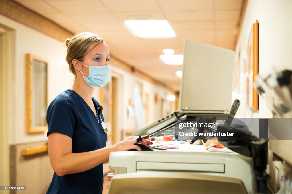 Nurse documenting during Covid-19