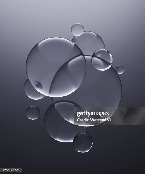 three dimensional render of transparent glass spheres against gray background - 3d glass stock illustrations