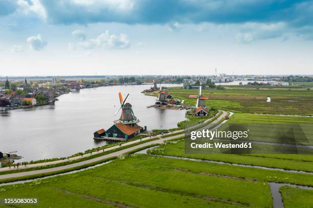 netherlands, north holland, zaandam, aerial view of historical windmills in zaanse schans - zaandam stock pictures, royalty-free photos & images