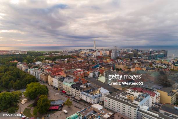 sweden, scania, malmo, aerial view of residential district with turning torso and oresund in background - oresund bridge stock pictures, royalty-free photos & images