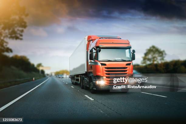 lorry motion traffic transport on motorway in motion - road front view stock pictures, royalty-free photos & images