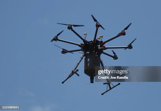 Florida Keys mosquito control department drone loaded with BTI larvicide is seen as it spreads it over an area to eradicate mosquitos carrying dengue...