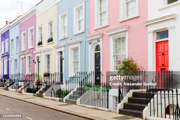 colorful townhouses in london, uk - london england stockfoto's en -beelden