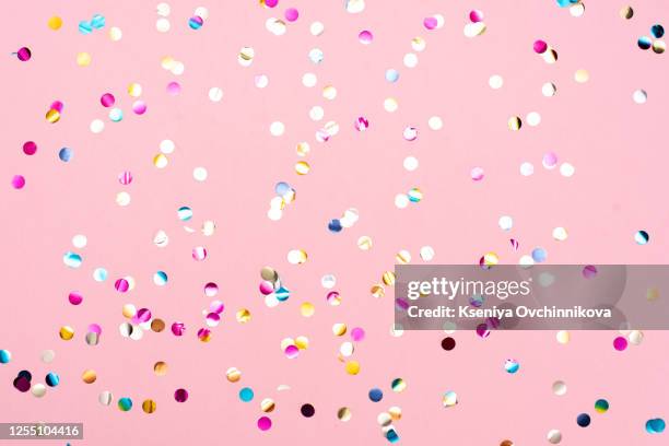 pink pastel festive background with confetti and sparkles. flat lay style. - pastel confetti stock pictures, royalty-free photos & images