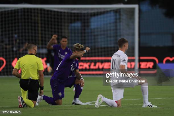 Referee Rubiel Vazquez, Dom Dwyer of Orlando City and Matias Pellegrini of Inter Miami 'take a knee' in support of the Black Lives Matter movement...