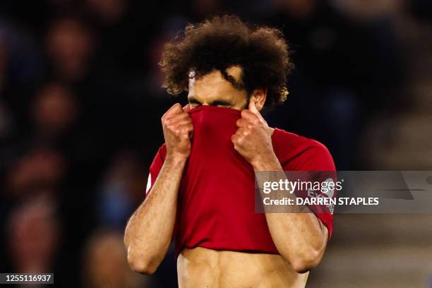 Liverpool's Egyptian striker Mohamed Salah reacts after a missed chance during the English Premier League football match between Leicester City and...