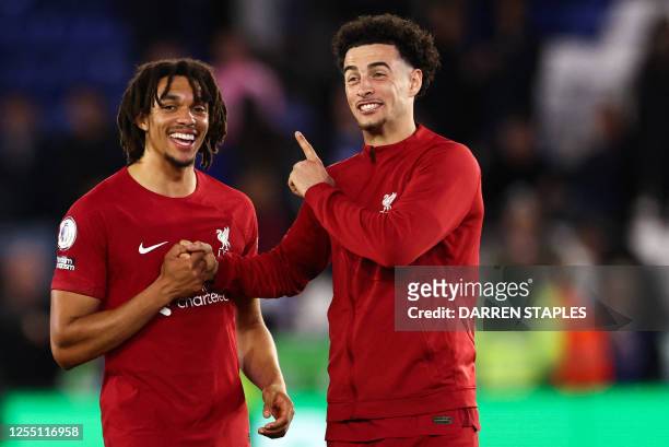 Liverpool's English defender Trent Alexander-Arnold and Liverpool's English midfielder Curtis Jones celebrate at the end of the English Premier...