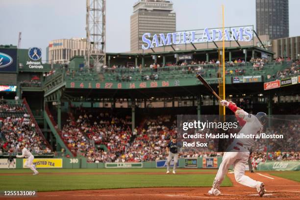 Justin Turner of the Boston Red Sox this a single during the first inning of a game against the Seattle Mariners on May 15, 2023 at Fenway Park in...