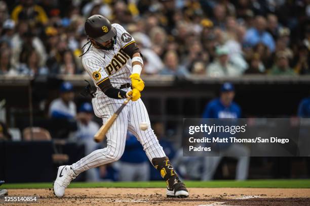 Fernando Tatis Jr. #23 of the San Diego Padres hits a single in the second inning against the Kansas City Royals on May 15, 2023 at Petco Park in San...