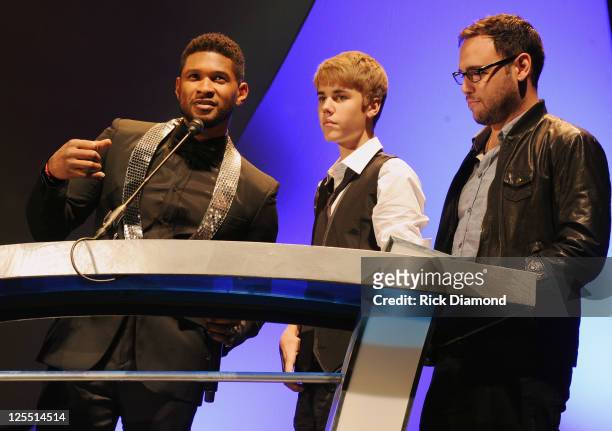 Singer/Songwriters Usher Raymond, Singer/Songwriter Justin Bieber and Bieber Mananger Scooter Braun present 2011 inducee Jan Smith at the 33rd Annual...