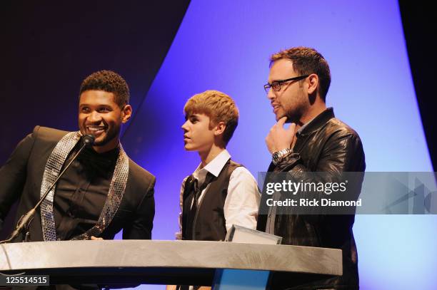 Singer/Songwriters Usher Raymond, Singer/Songwriter Justin Bieber and Bieber Mananger Scooter Braun present 2011 inducee Jan Smith at the 33rd Annual...