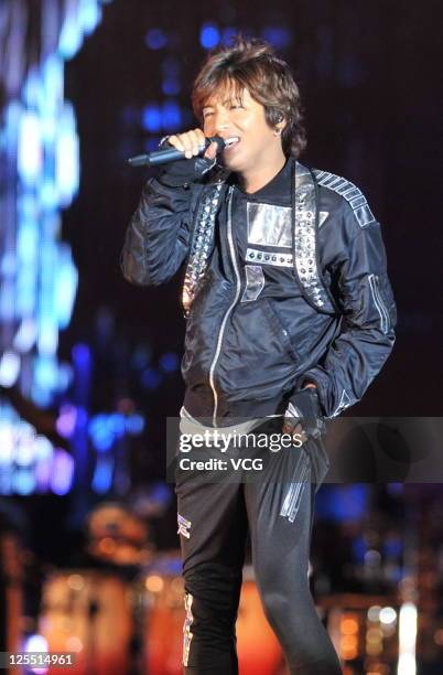 Kimura Takuya of Japanese boy band SMAP performs on the stage at Beijing Concert at Beijing Workers Stadium on September 16, 2011 in Bejing, China.