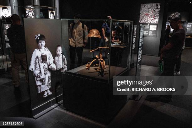 This photo taken on May 15, 2023 shows a tricycle donated by Nobuo Tesutani - the father of a boy who died in the 1945 atomic bombing, on display at...