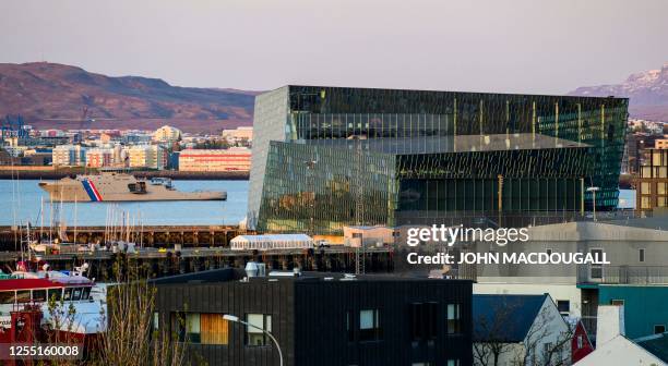 Picture taken on May 15, 2023 shows a ship of the Icelandic Coast Guard partoling off the coast next to the Harpa Concert hall in Reykjavik, Iceland,...