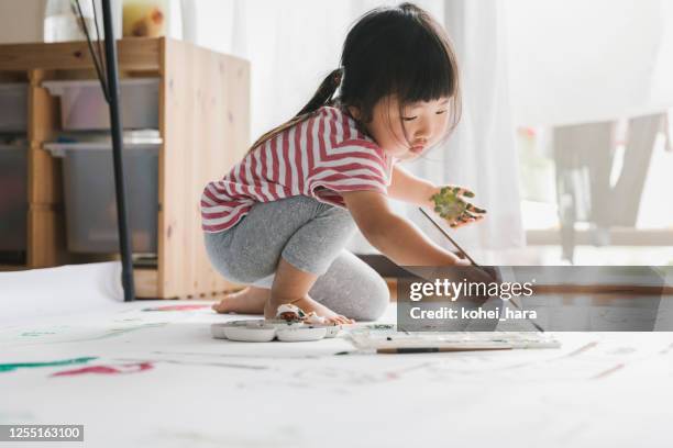 girl drawing a picture with paint - japanese art stock pictures, royalty-free photos & images