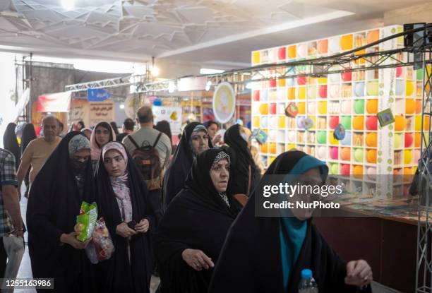 Veiled Iranian women visit Tehran International Book Fair at the Imam Khomeini grand mosque in downtown Tehran, May 14, 2023.