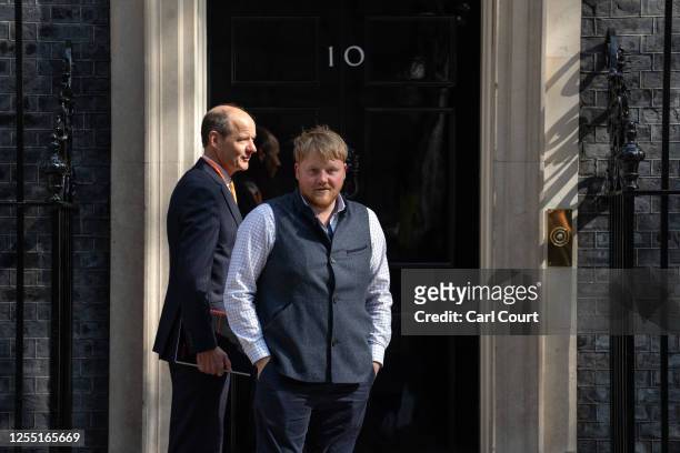 Kaleb Cooper , a farming contractor and advisor to Jeremy Clarkson on his farming show, arrives with fellow advisor Charlie Ireland in Downing Street...