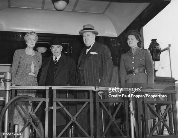 Prime Minister of the United Kingdom Winston Churchill stands in centre with, from left, Clementine Churchill , Prime Minister of Canada William Lyon...
