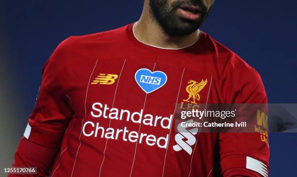 The NHS badge on the front of a New Balance Liverpool shirt during the Premier League match between Brighton & Hove Albion and Liverpool FC at...