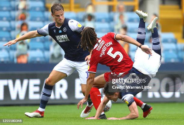 Ben Thompson of Millwall is tackled by Ryan Shotton of Middlesbrough during the Sky Bet Championship match between Millwall and Middlesbrough at The...