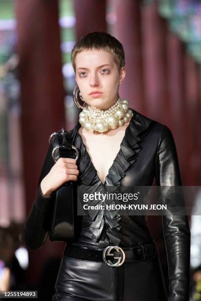 Model presents a creation by Italian brand Gucci during the Gucci 2024 Cruise Collection Fashion Show at Gyeongbok-gung Palace in Seoul on May 16,...