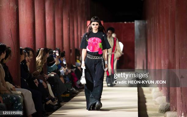 Models present a creation by Italian brand Gucci during the Gucci 2024 Cruise Collection Fashion Show at Gyeongbok-gung Palace in Seoul on May 16,...