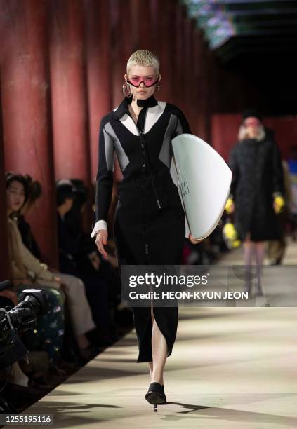 Models present a creation by Italian brand Gucci during the Gucci 2024 Cruise Collection Fashion Show at Gyeongbok-gung Palace in Seoul on May 16,...