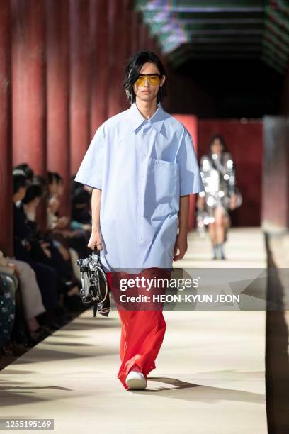 Models present a creation by Italian brand Gucci during the Gucci 2024 Cruise Collection Fashion Show at Gyeongbok-gung Palace on May 16, 2023.