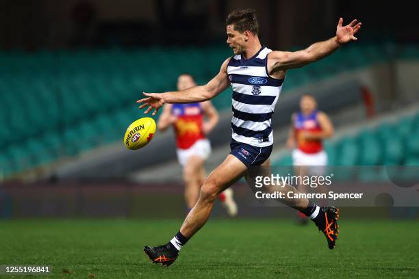 Tom Hawkins of the Cats kicks a goal during the round 6 AFL match between the Geelong Cats and the Brisbane Lions at Sydney Cricket Ground on July...