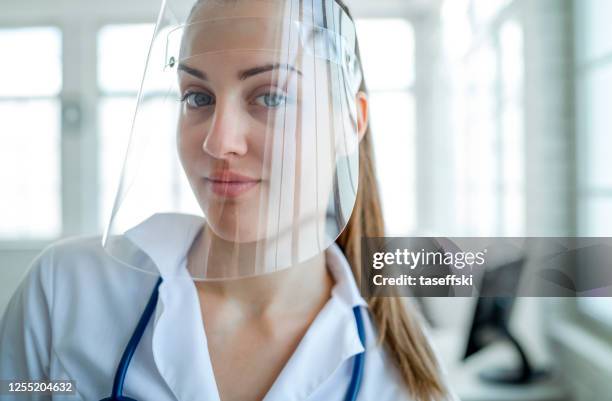 female doctor - helmet visor stock pictures, royalty-free photos & images