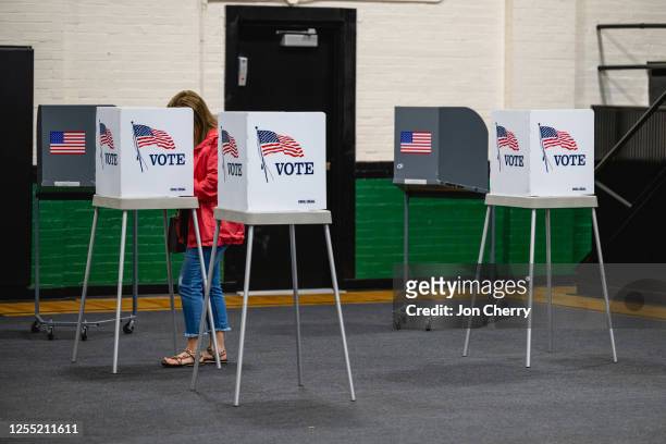 Voter casts their ballot in the Kentucky Primary Elections at polling place in the Simpsonville Community Gym on May 16, 2023 in Simpsonville,...