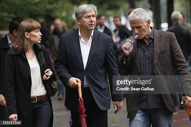 Berlin mayor and incumbent candidate of the German Social Democrats Klaus Wowereit and his partner Joern Kubicki depart after casting their ballots...
