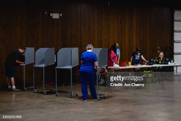 Voters cast their ballots in the Kentucky Primary Elections at polling place in the Shelby County Fairgrounds on May 16, 2023 in Shelbyville,...