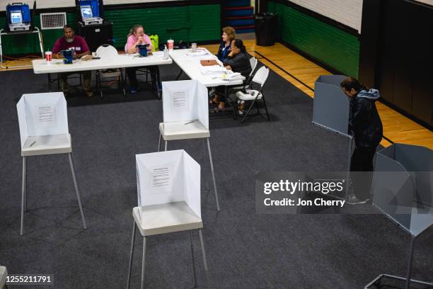 Voter casts their ballot in the Kentucky Primary Elections at polling place in the Simpsonville Community Gym on May 16, 2023 in Simpsonville,...