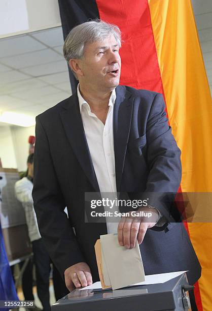 Berlin mayor and incumbent candidate of the German Social Democrats Klaus Wowereit casts his ballot in Wilmersdorf district in Berlin city elections...