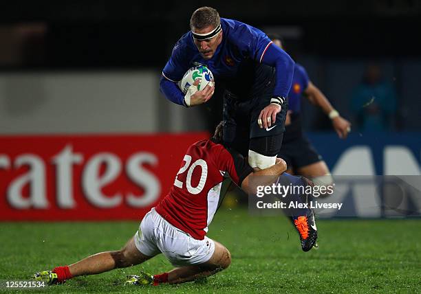 Imanol Harinordoquy of France is tackled by Sean White of Canada during the IRB 2011 Rugby World Cup Pool A match between France and Canada at McLean...