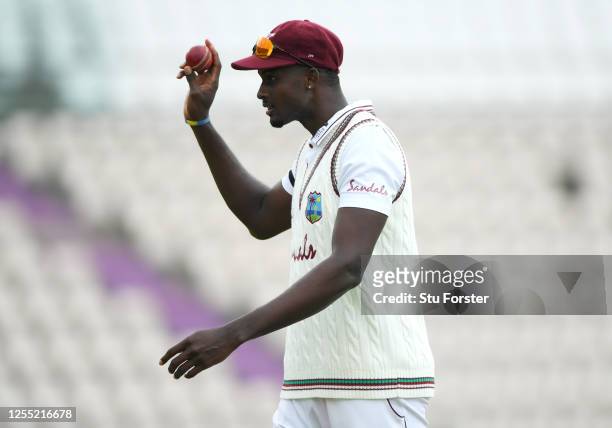 West Indies captain Jason Holder salutes the dressing room as he leaves the field after taking 6 wickets during day two of the 1st #RaiseTheBat Test...