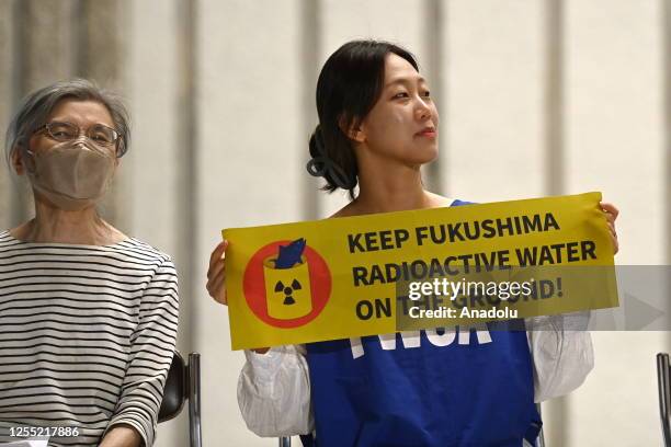 People protest against the plan of Japan government and Tokyo Electric Power Company to release the massive radioactive water stockpile from...