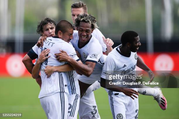 Alejandro Bedoya of Philadelphia Union celebrates with his teammates after scoring a goal during the second half of the game against the New York...