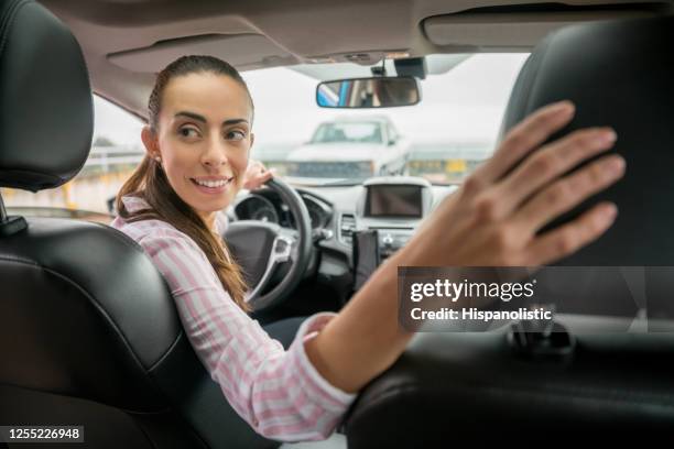 woman parking her car - car in car park stock pictures, royalty-free photos & images