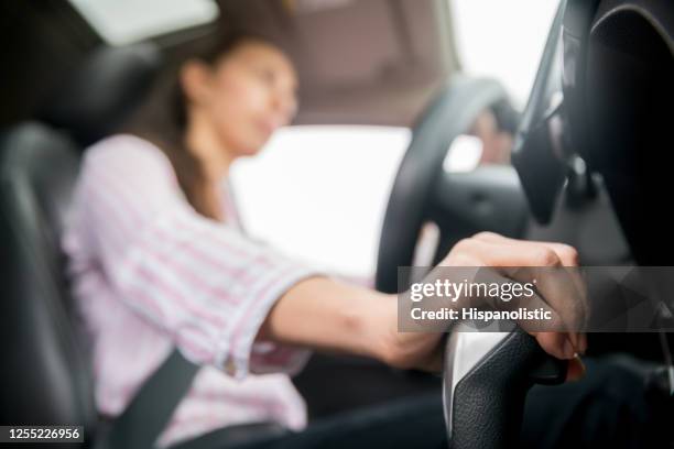 close-up on a woman driving with her hand on the gear stick - gears stick imagens e fotografias de stock