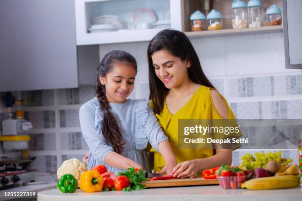 happy family in the kitchen. stock photo - cooking indian food stock pictures, royalty-free photos & images