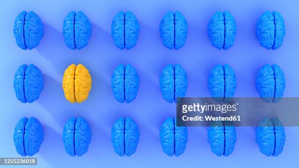 pattern of rows of blue colored human brains with single yellow one - repetition stock-grafiken, -clipart, -cartoons und -symbole
