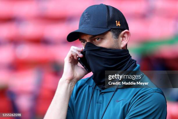 Red Sox Chief Baseball Officer Chaim Bloom takes a phone call during Summer Workouts at Fenway Park on July 09, 2020 in Boston, Massachusetts.