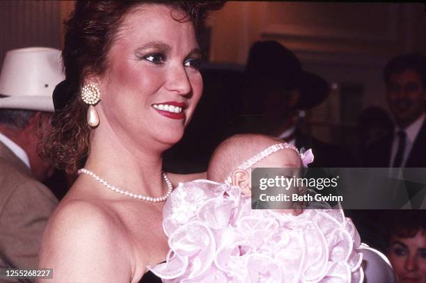 Country Singer and Songwriter Tanya Tucker With Baby Presley at a Party in 1990 in Nashville, Tennessee.