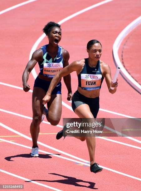 Allyson Felix takes a handoff from Tianna Bartoletta on their way to a first place finish in the women's 3 x 100 meter relay during the Weltklasse...