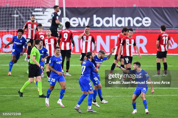 Ever Banega of Sevilla FC celebrates with his team mates after scoring his team's first goal during the Liga match between Athletic Club and Sevilla...