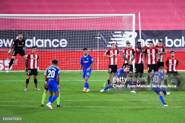 Ever Banega of Sevilla FC scores his team's first goal during the Liga match between Athletic Club and Sevilla FC at San Mames Stadium on July 09,...