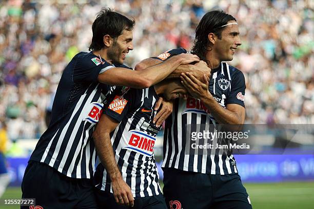 Cesar Delgado of Monterrey celebrates a scored goal with teammates during a match as a part of the Apertura 2011 Tournament in the Mexican Football...