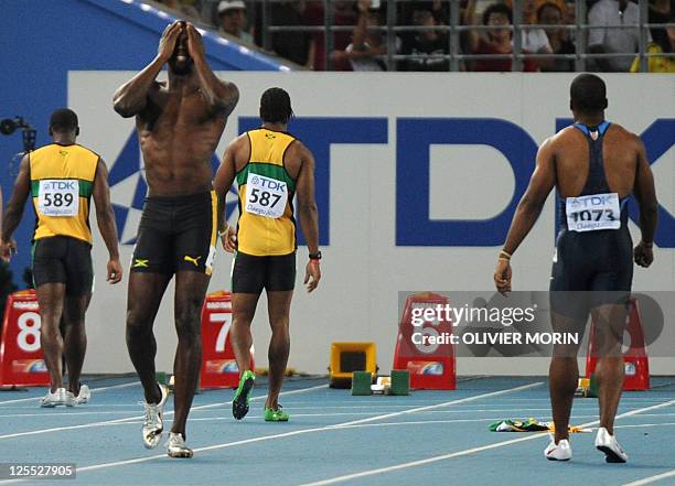 Jamaica's Usain Bolt reacts after a false start in the men's 100 metres final at the International Association of Athletics Federations World...